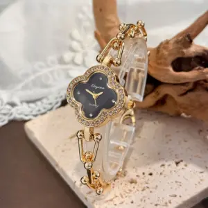Lucky Four-Leaf Clover Design Watches for Women, Featuring Gold Chains and Gem - Studded Bezels